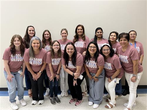 The Structured classroom team smiling in their Skaggs Spirit shirts
